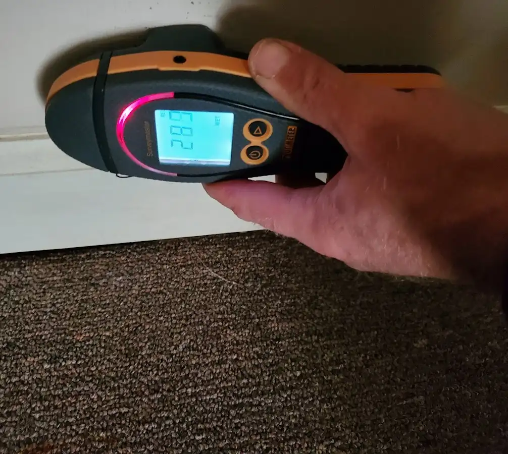 Moisture detection at baseboard during Sewage Cleanup & Sanitation in Miami